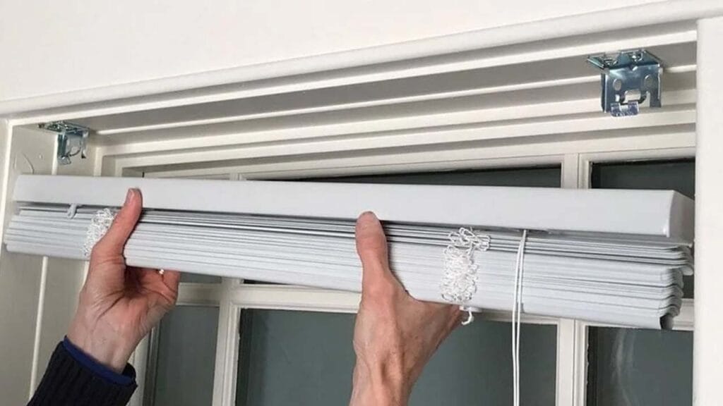 spring-loaded brackets to remove venetian blinds